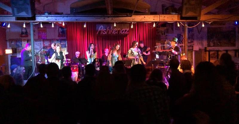 Wide crowd view of Enjoyus performing live at Ashkenaz